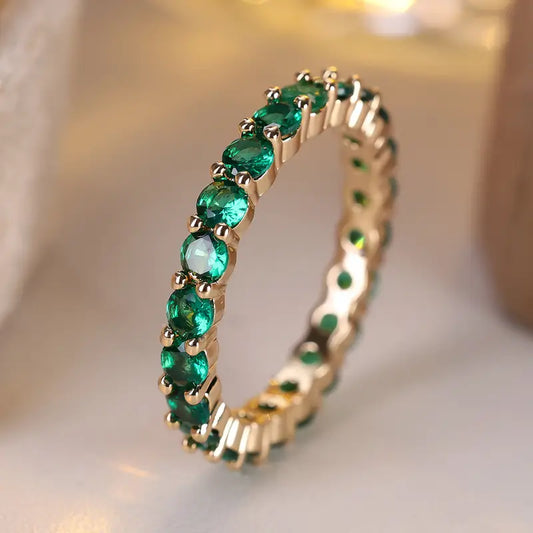 Gold emerald eternity ring