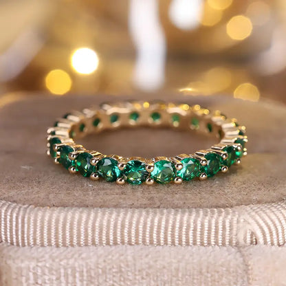 Gold emerald eternity ring
