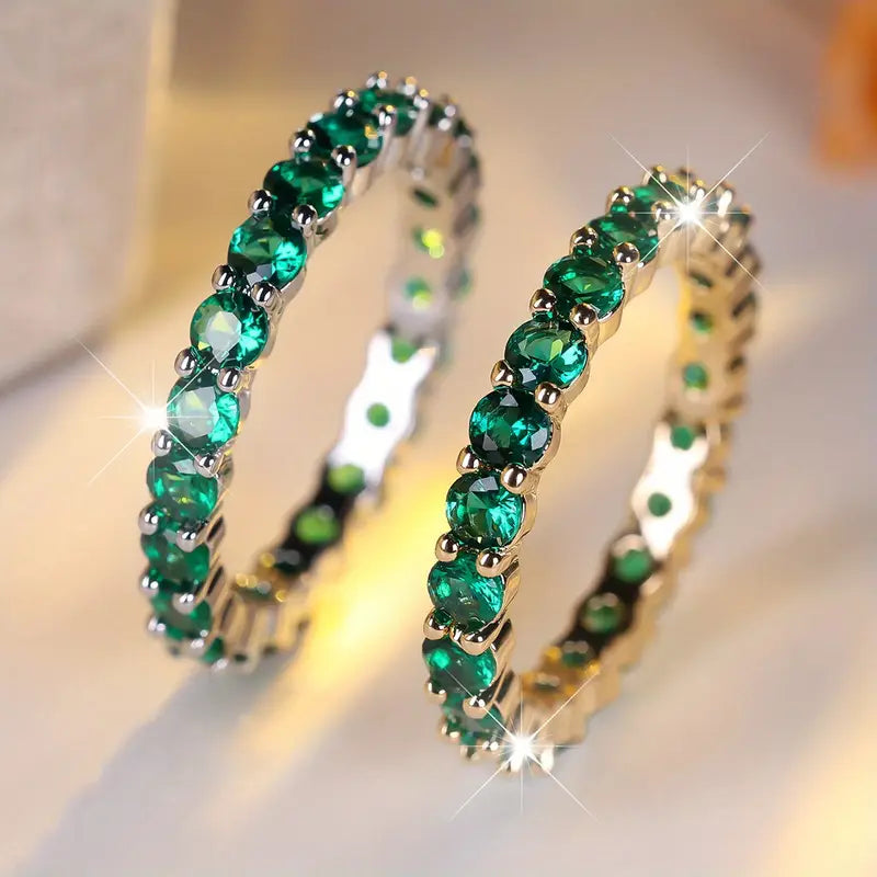Gold emerald eternity ring