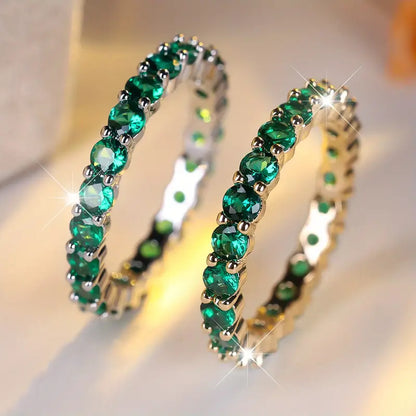 Gold emerald eternity ring