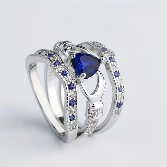 Silver sapphire interlocking ring