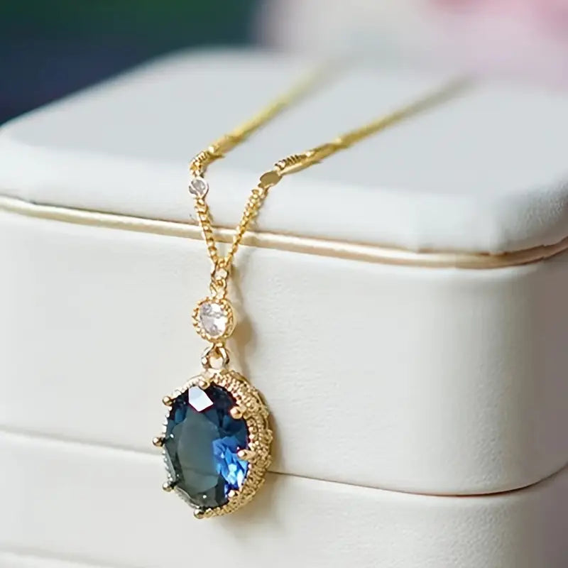Gold sapphire oval drop necklace