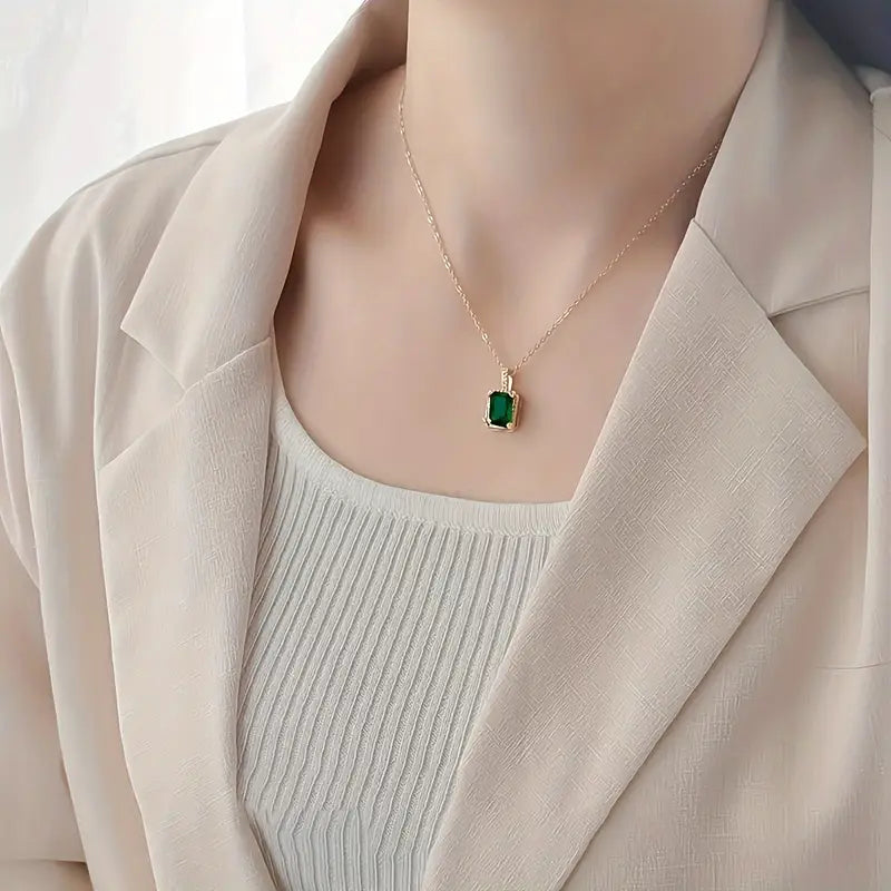 Gold emerald rectangular halo necklace