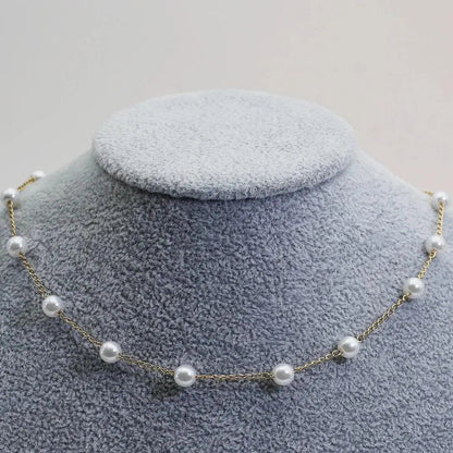 Gold spaced pearl chain necklace
