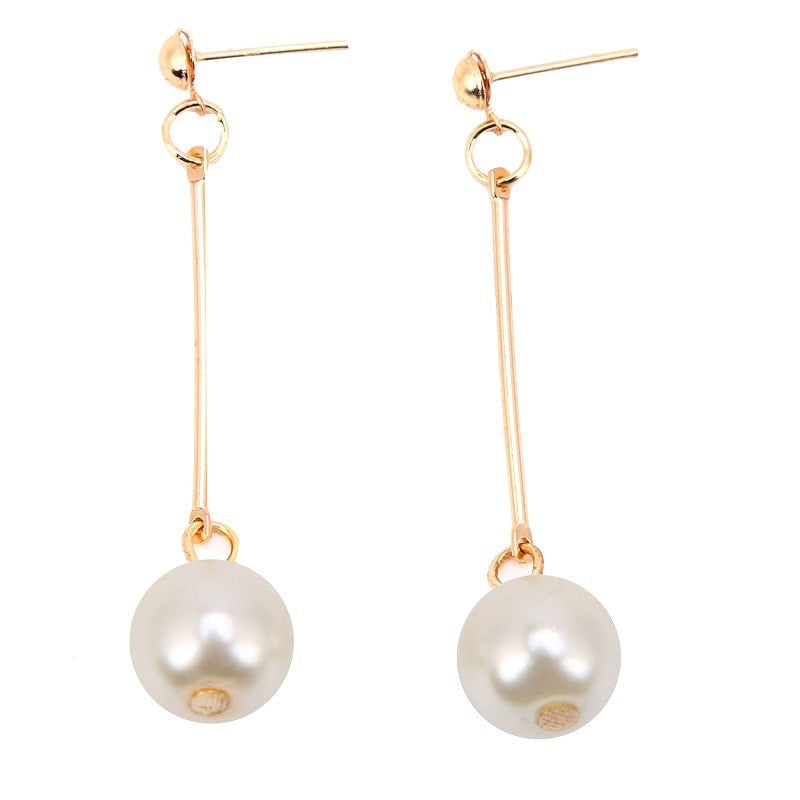 Gold long pearl drop earrings