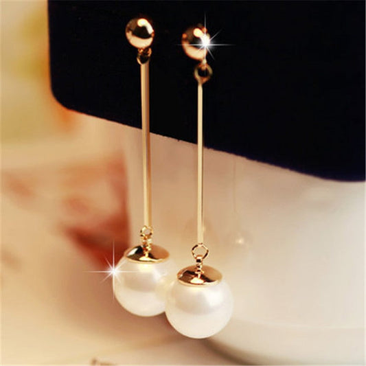 Gold long pearl drop earrings