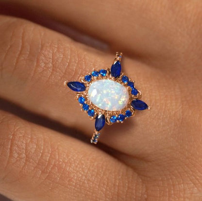 Rose Gold Halo Oval Cut Opal & Blue Sapphire Engagement Ring