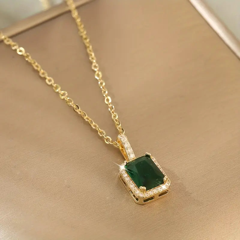 Gold emerald rectangular halo necklace